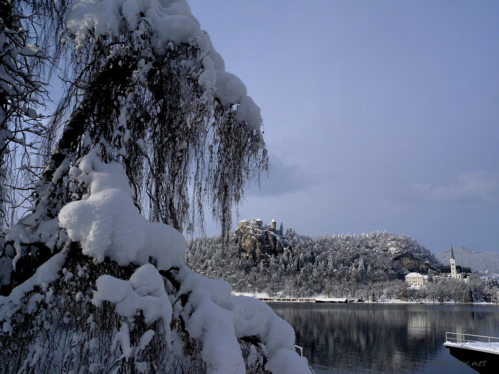 Thick snow cover makes Lake Bled an romantic place - Slovenia