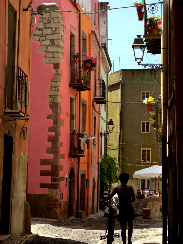 The historic centre of the Bosa town - Sardinia, the Sa Costa district, is an intriguing maze of medieval streets, stone staircases and terraces of tall houses painted in bright or pastel colours