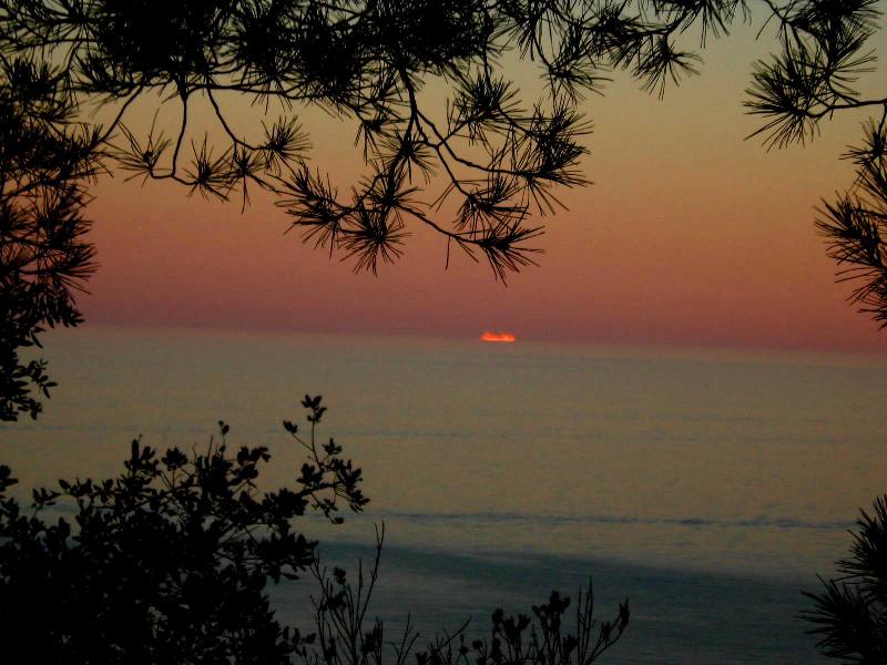Sunset in camp site of Cala Llevado - Costa Brava, Spain 