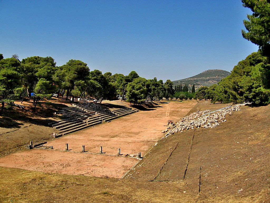 The stadium of ancient Epidaurus was built between two small hills, and is 196.44 meters long, 23 m. wide, and has a 181.30 m. long course.There were 22 rows of seats on the right side and 14 rows on the left - Greece 