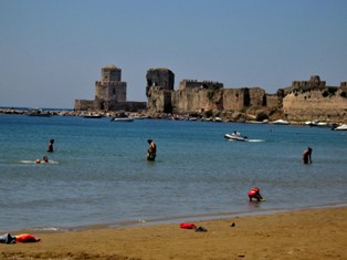 Methoni beach with Castle in background Greece