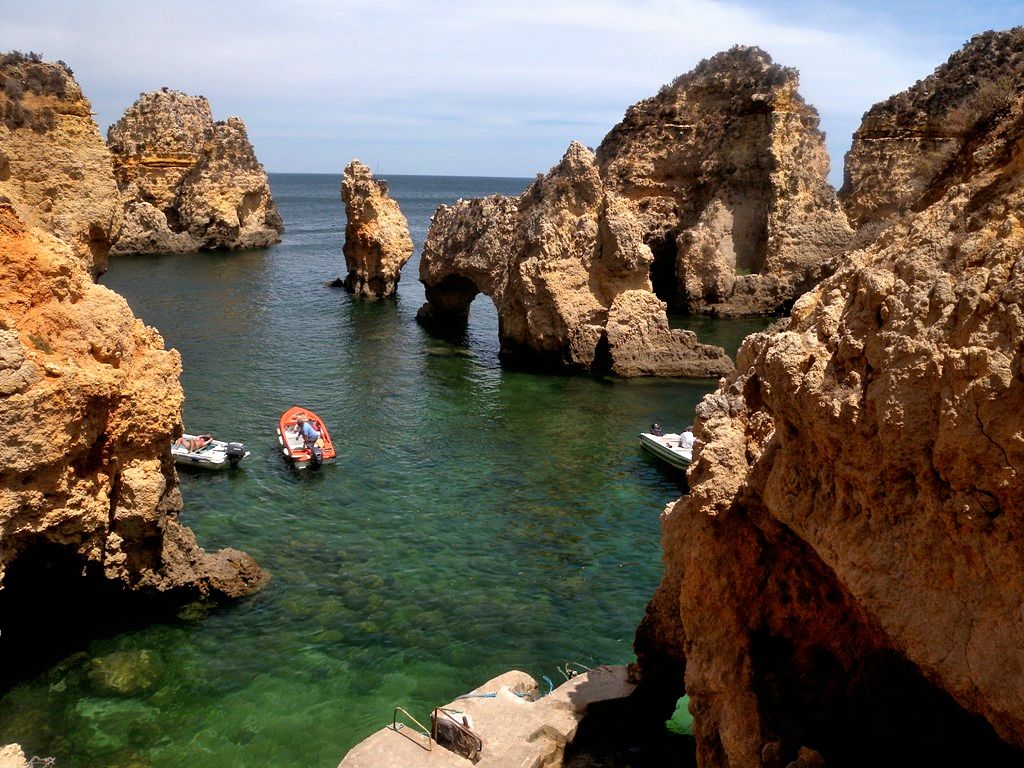 Ponta da Piedade is a lighthouse and rock formation on the southern corner of the bay of Lagos. This bizarre scenery with cliffs of up to 20 metres - Portugal
