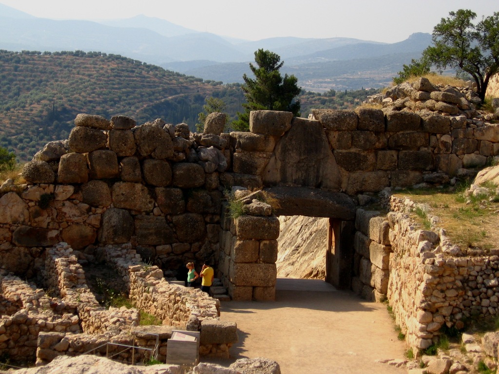 The Lion Gate to Mycenae citadel is an stone construction 3.10 m (10 ft) wide and 2.95 m (10 ft) high. The twin lions had heads made of metal, but they have long since disappeared