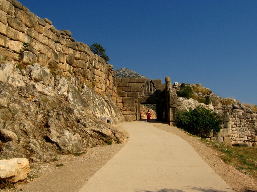 The Lion Gate of Mycenae was the entrance to the city. At the top of the gate, two lions rampant are carved in stone relief - Ancient Mycenae Greece 