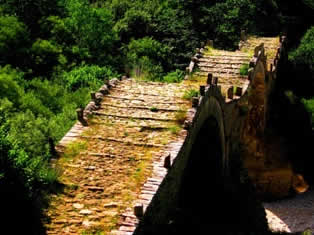 Kalogeriko triple-arch stone bridge, at least 300 years old, near Kipi, Zagoria