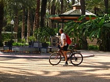 With bike along the Elche town streets