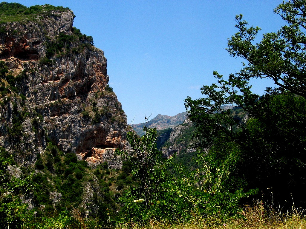 Observing the limestone rocks of Lousios Gorge you will see many caves which hosted hermit monks, many of hiding places are accessible but only to experienced climbers - Peloponnese Greece 