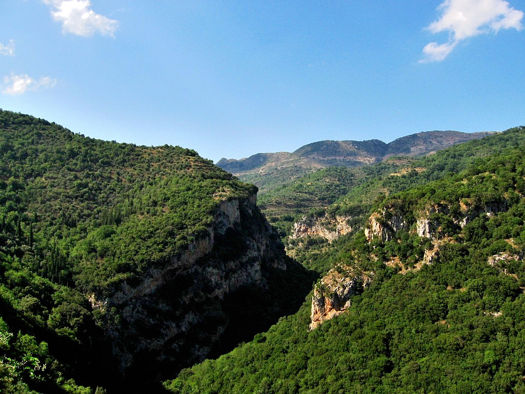 The deep Lousios River Gorge, whose red cliffs rise to more than 980 feet, runs some 12 miles between the villages of Dimitsana and Karitaina - Peloponnese Greece 