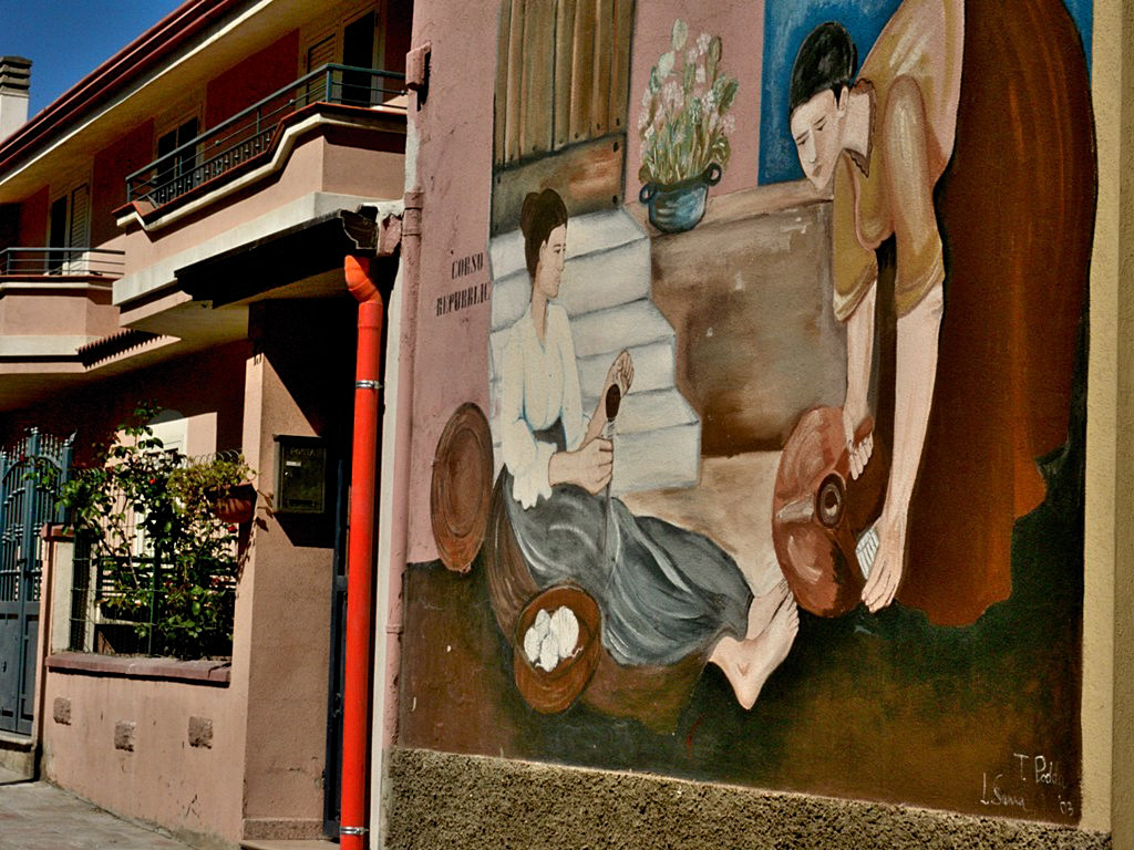 Orgosolo village - Sardinia is famous for its murales, a sort of street art graffiti, where local artists paint the walls of the town with stories. 