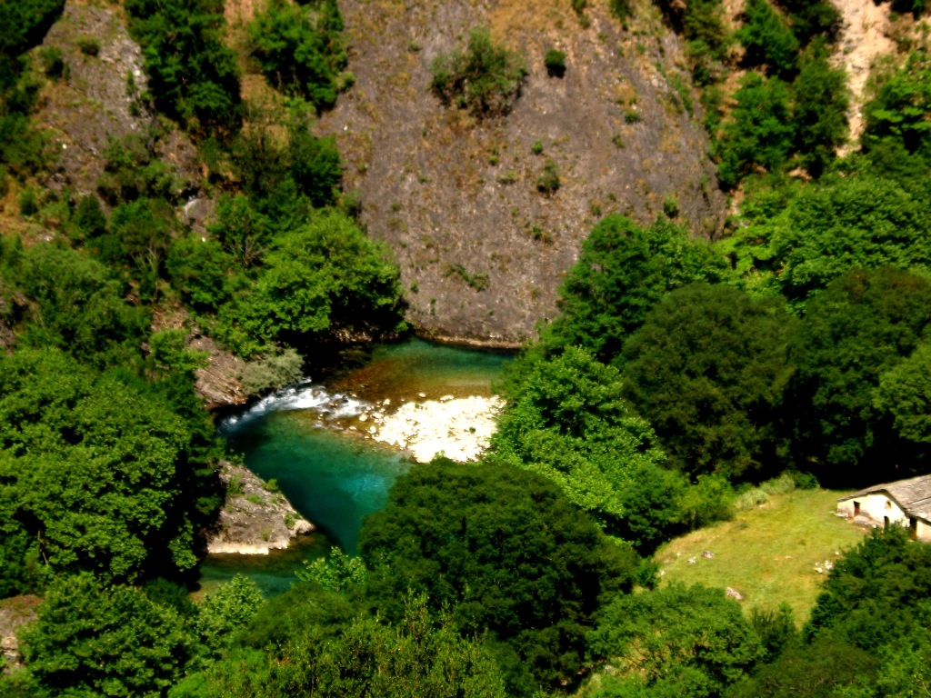 Amazing river Voidomatis has crystal clear waters at a stable temperature of 4  C all year round. The water flow of the river in the upper parts of the Vijos Gorge is seasonal - Greece 